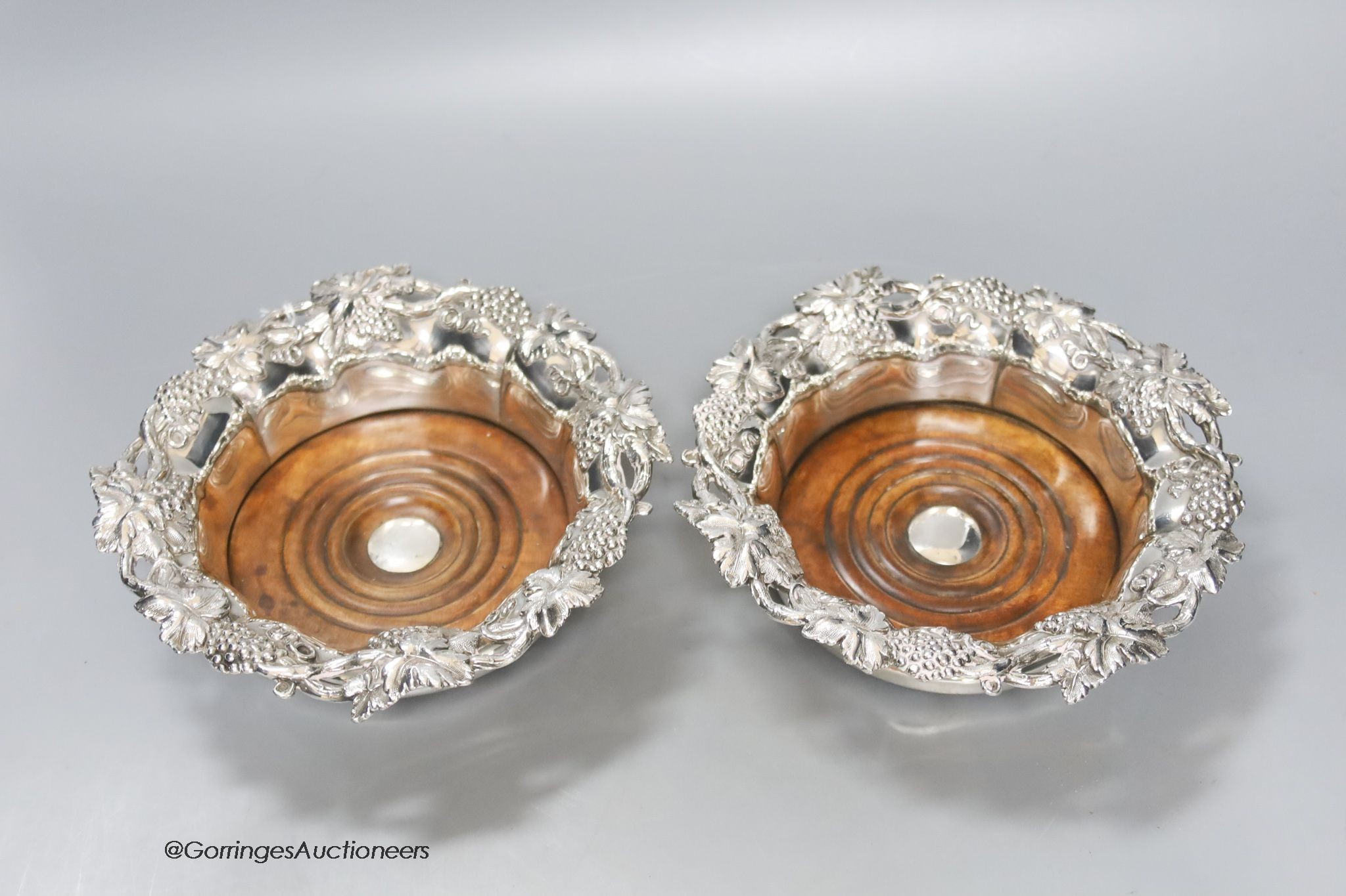 A pair of Victorian silver plated wine coasters, 19cm